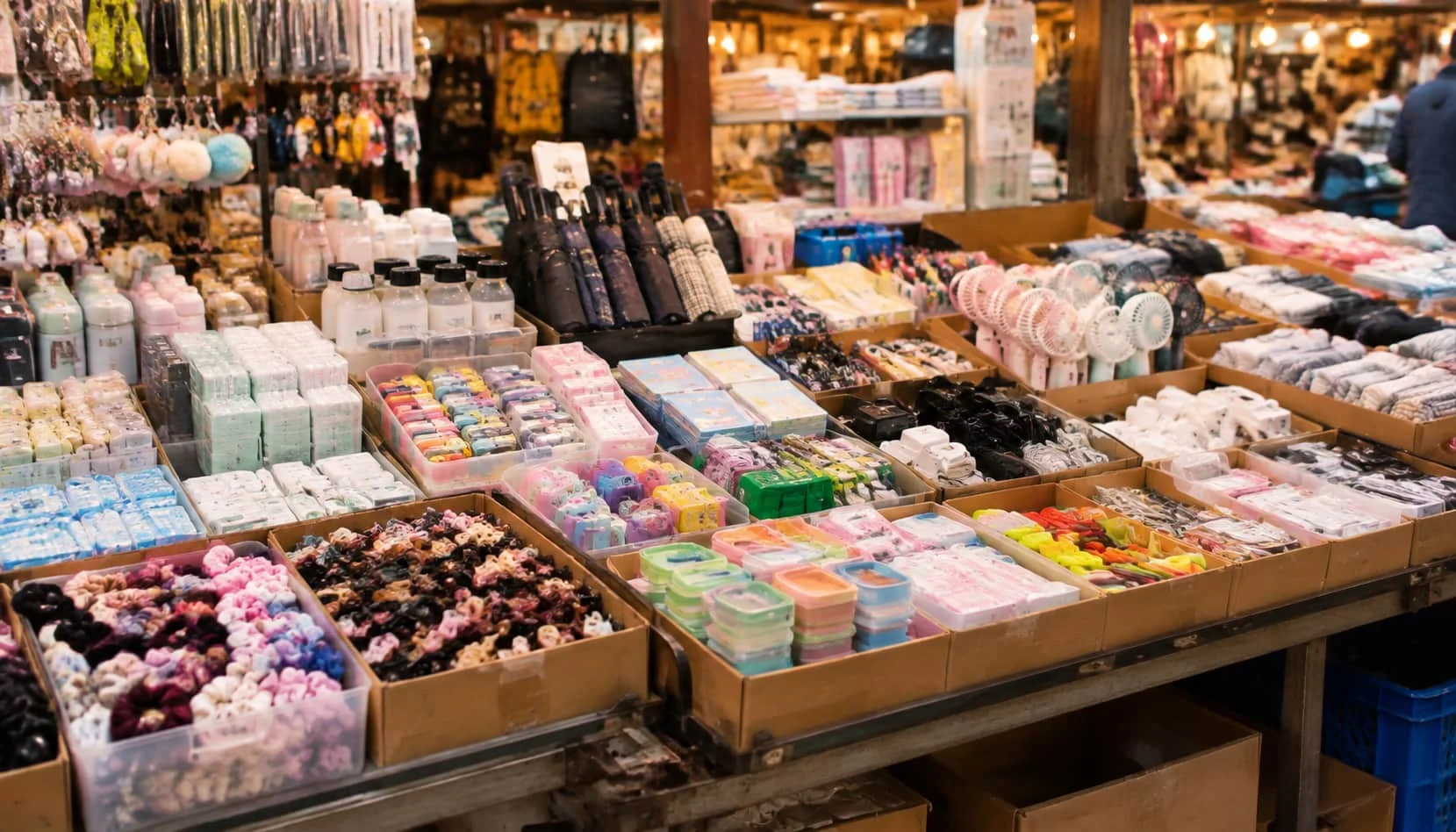 Wholesale market stall displaying small mixed lots of goods in Yiwu, China